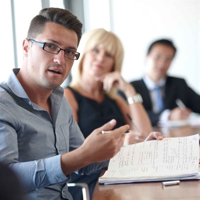 Business People at a Meeting Table.