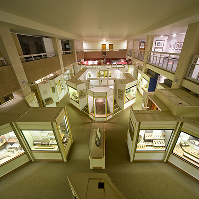 Illuminated display cases inside Newport Museum and Art Gallery