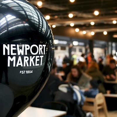 A balloon with Newport Market written on it, with the market blurred in the background