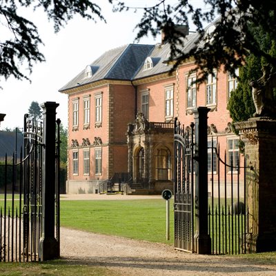 An image of Tredegar House looking through the gates into the grounds