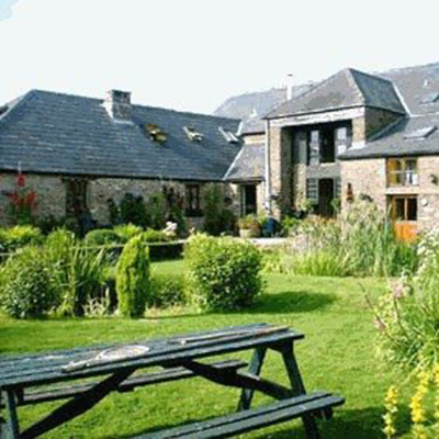 An image of The Granary buildings showing the garden with picnic bench