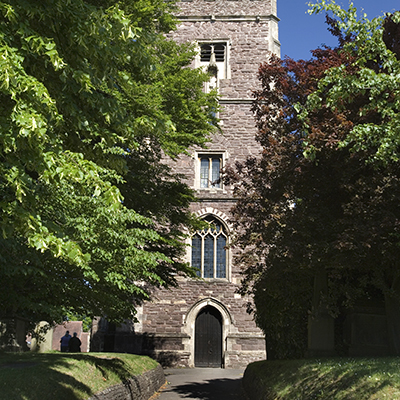 The entrance to St Woolos Cathedral viewed through trees